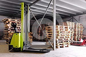 Forklifter stacker in warehouse photo