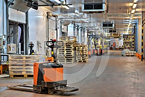 Forklifts pallet truck in loading dock inside cold storage wa