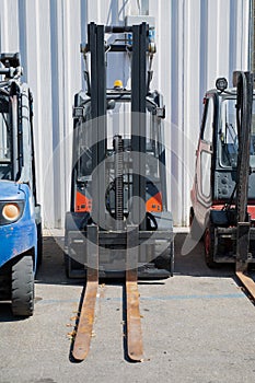 Forklifts Parked outside a Storage Center