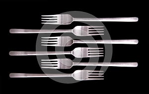 Forks on black background