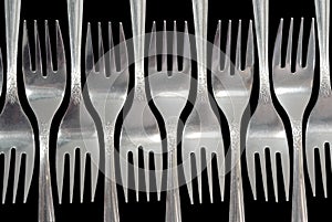 Forks on a black background