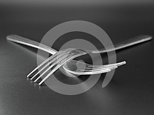 Forks crossing bodies utensils eatery