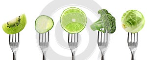 Forks with different vegetables and fruits on background, banner design. Healthy meal