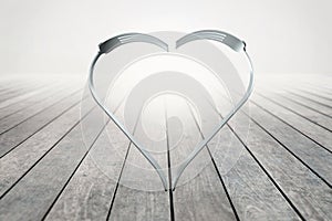 Forks heart on wood background