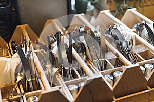 Forks, knifes and spoons in restaurants interior.