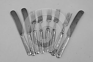 Antique cutlery with richly decorated handles photo