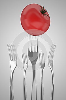 Forks and tomato vegan concept