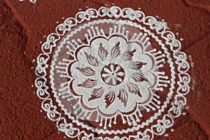 Form of drawing by using rice flour/chalk powder practiced in South India photo