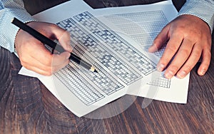 Form for the exam before the man on the table. Testing for training and hiring. Right-handed and left-handed. Selective focus. Ton