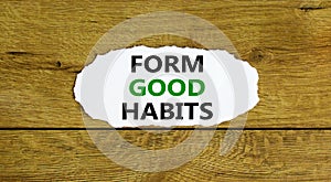 Form good habits symbol. Words `Form good habits` on white paper. Beautiful wooden background. Business, psychology and form goo