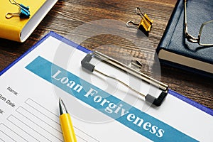 Form of Loan Forgiveness Agreement and yellow pen.