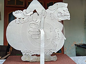 in the form of a shadow puppet character named Semar