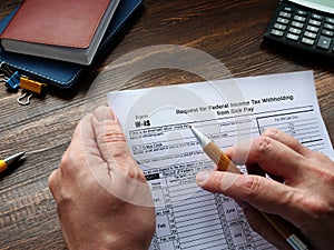 Form W-4S Request for Federal Income Tax Withholding from Sick Pay sign on the sheet