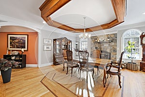 Formal dining room features a large wood table and chairs