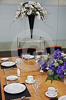 Formal dining table set up with cut flowers