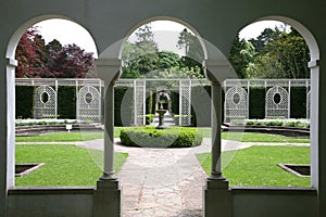 Formal garden through arched windows