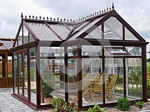 Formal garden glass pavilion with furniture