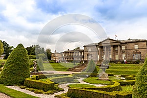 Formal garden and an historic mansion  at Tatton Park in England.