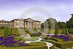 Formal garden and a mansion house.