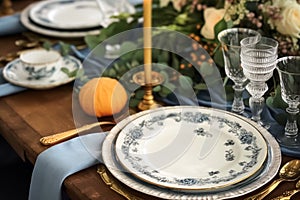 Formal holiday tablescape with blue decor, dinner table setting, table scape with elegant tableware and dinnerware for