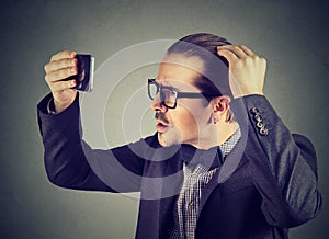 Formal man exploring hair health