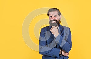 formal office style. smiling man with beard wearing business jacket. elegant male fashion model. dress code concept