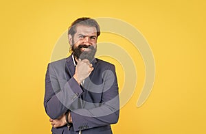 formal office style. smiling man with beard wearing business jacket. elegant male fashion model. dress code concept