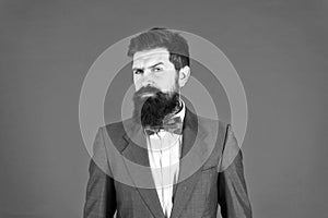 Formal outfit. Confident posture. Businessman or host fashionable outfit red background. Man bearded hipster wear