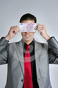 Formal young businessman with 500 euro note