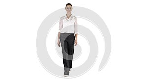 Formal young woman walking and smiling on white background.