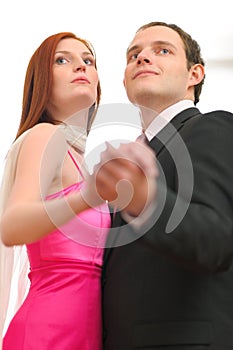 Formally dressed dancing couple photo