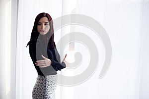 Formally dressed young brunette woman photo