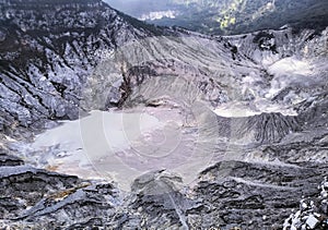 the formation of a beautiful volcanic crater that appears to emit billowing smoke