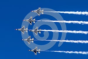 Formation of jet aircrafts flies as a team in blue sky.