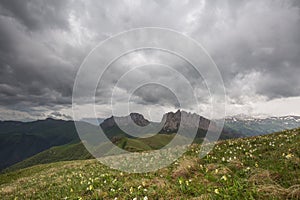 The formation and movements of clouds up to the steep slopes of the mountains of Central Caucasus peaks.