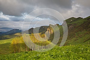 The formation and movements of clouds up to the steep slopes of the mountains of Central Caucasus peaks.