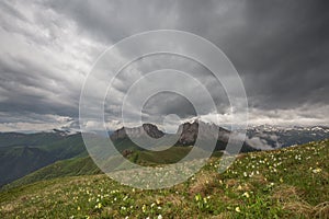 The formation and movements of clouds up to the steep slopes of the mountains of Central Caucasus peaks.