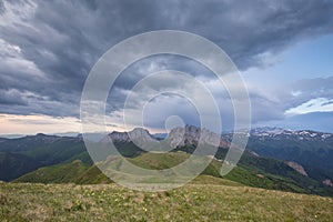 The formation and movements of clouds up to the steep slopes of the mountains of Central Caucasus peaks.