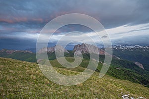 The formation and movements of clouds up to the steep slopes of the mountains of Central Caucasus peaks.