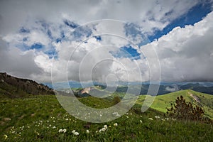 The formation and movements of clouds up to the steep slopes of the mountains of Central Caucasus peaks.