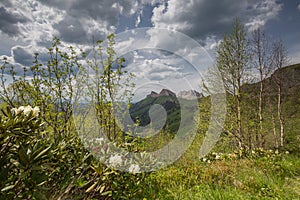 The formation and movements of clouds up to the steep slopes of the mountains of Central Caucasus peaks.