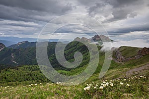 The formation and movements of clouds up to the steep slopes of the mountains of Central Caucasus peaks.