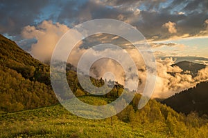 The formation and movements of clouds up to the steep slopes of the mountains of Central Caucasus peaks.