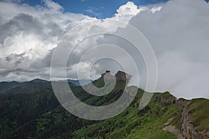 The formation and movements of clouds up to the steep slopes of the mountains of Central Caucasus peaks.