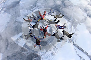 Formation skydiving. A group of skydivers is in the winter season. photo