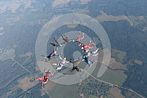 Formation skydiving. Skydivers are falling in the sky.