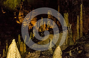 Formation of stalagmites and stalactites in the caves photo