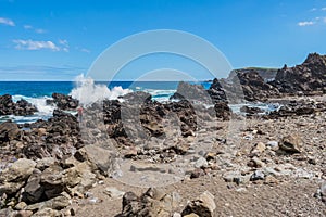 Formation of volcanic rocks between the sand and the sea at Quatro Ribeiras beach, Terceira - Azores PORTUGAL photo