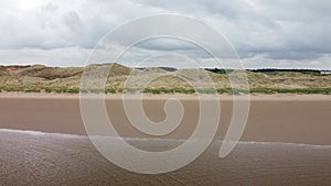 Formby Beach is a popular tourist destination located on the coast of the Irish Sea in Merseyside, England