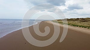 Formby Beach is a popular tourist destination located on the coast of the Irish Sea in Merseyside, England